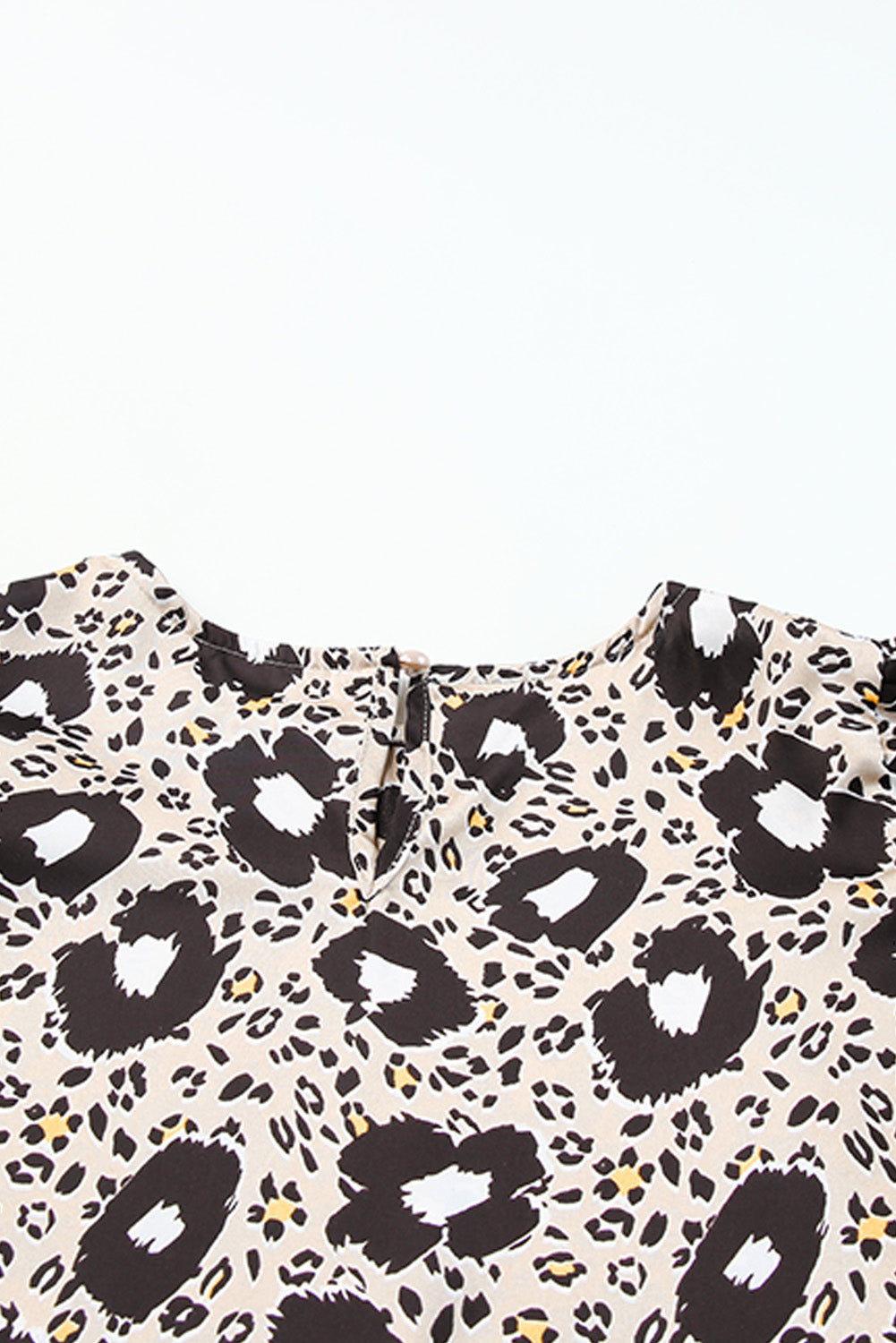 Stylish round neck blouse with animal print and puff sleeves